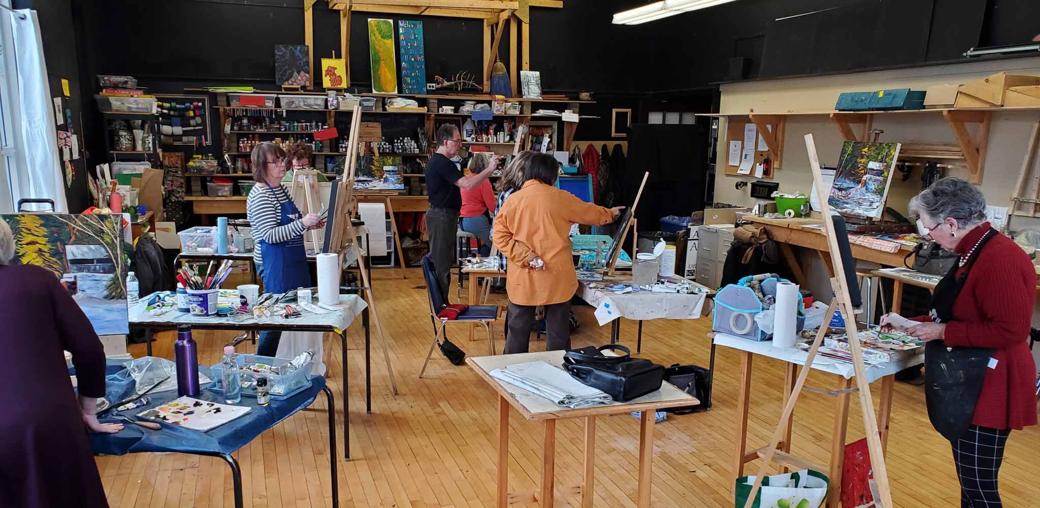 Studio 201 Artist Collective studio space featuring big windows for natural light, tall ceilings and hardwood floors.