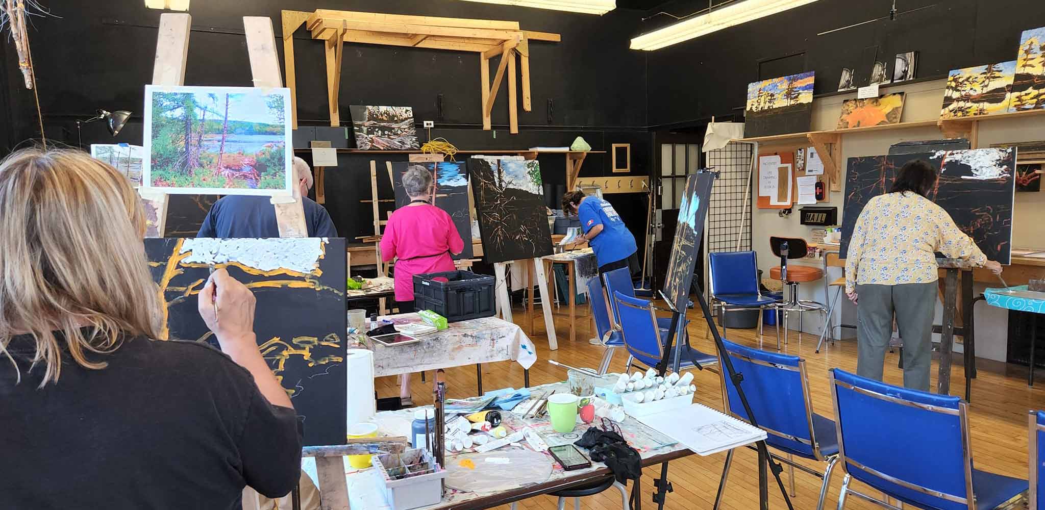 Studio 201 Artist Collective; a welcoming studio space featuring big windows for natural light, tall ceilings and hardwood floors.