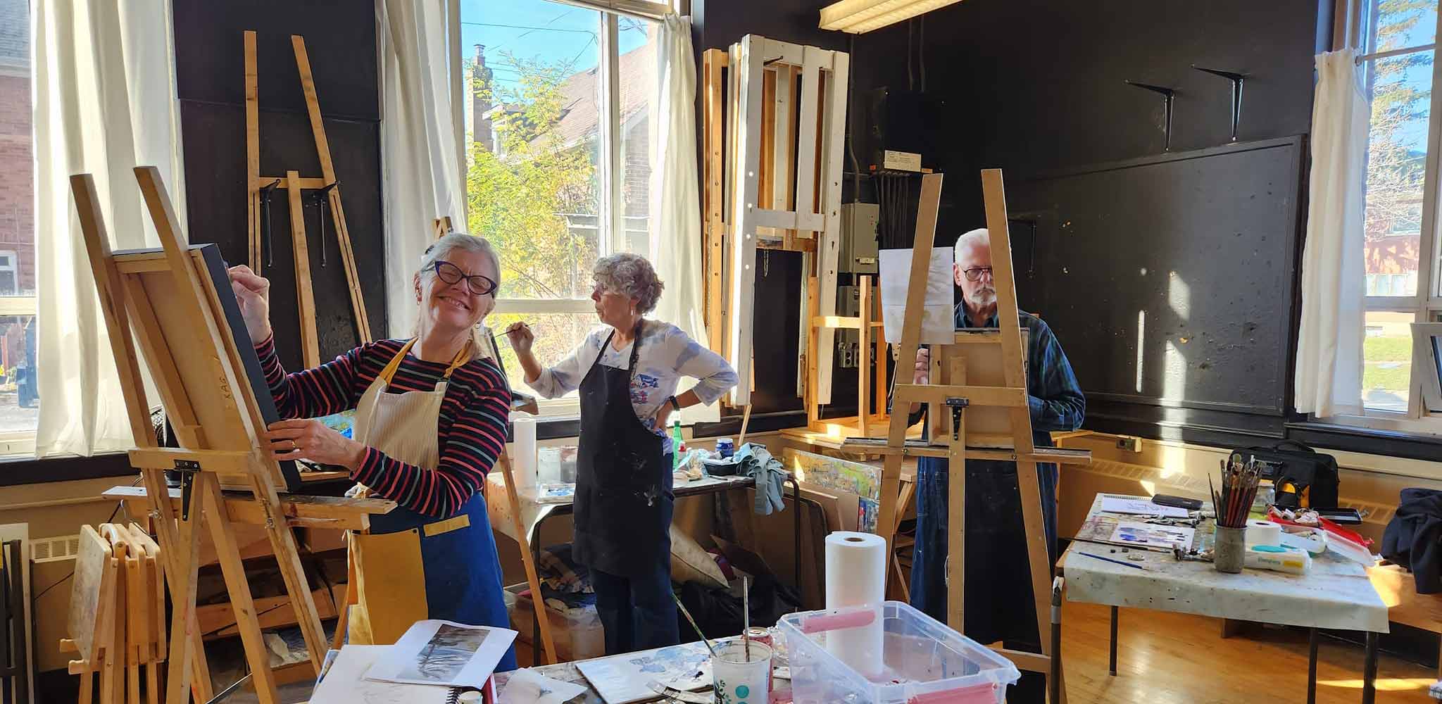 Studio 201 Artist Collective; a welcoming studio space featuring big windows for natural light, tall ceilings and hardwood floors.